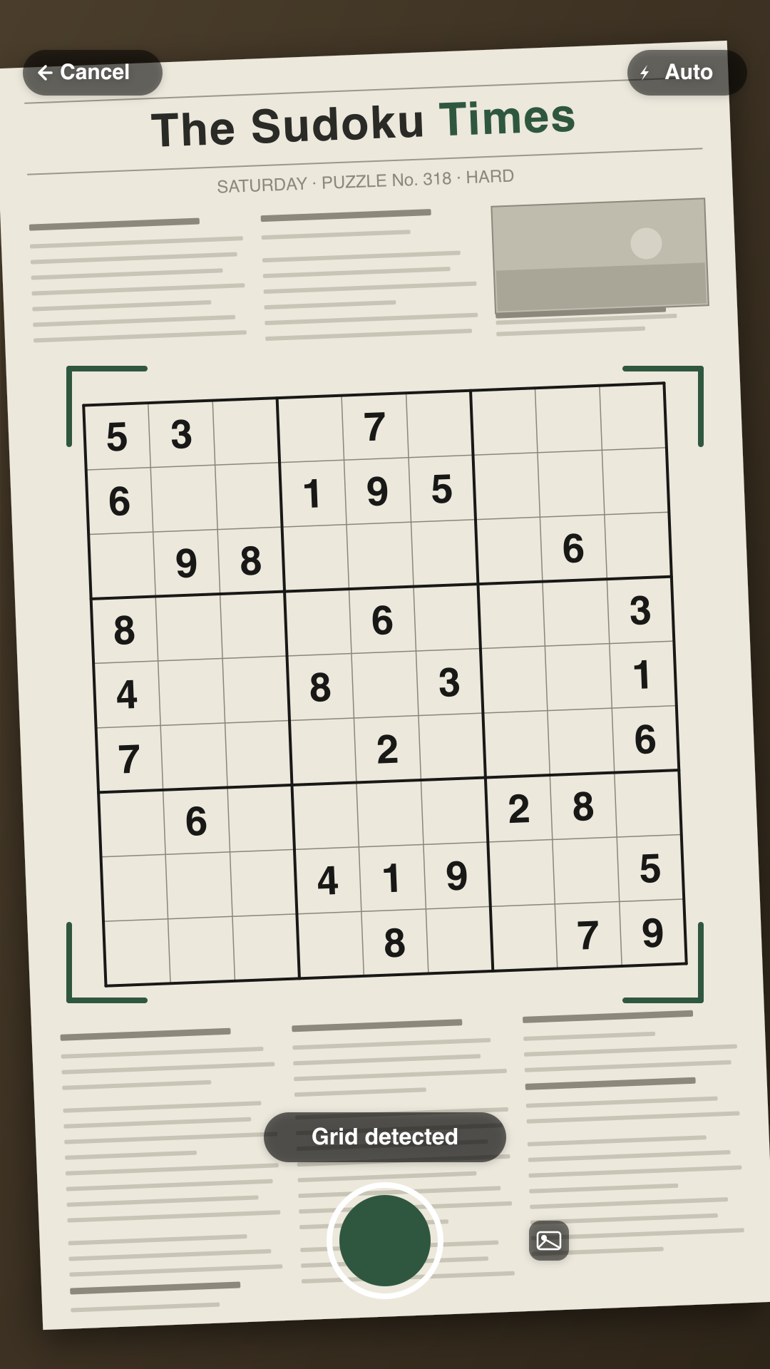 Sudoku app scanning a printed newspaper puzzle, with the grid detected